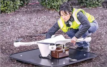  ?? UPS/AFP ?? A Matternet drone is loaded with a UPS sample box. On March 26, US delivery giant UPS launched the first authorised use of unmanned drones to transport packages.