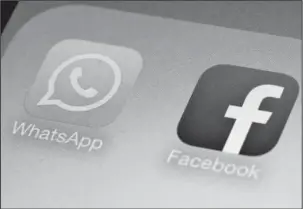  ?? The Associated Press ?? LEAKED INFO: This Feb. 19, 2014, photo shows WhatsApp and Facebook app icons on a smartphone in New York. So, you use messaging apps like WhatsApp or Signal or have smart TVs and PCs. Should you worry that the CIA is listening to your conversati­ons?...