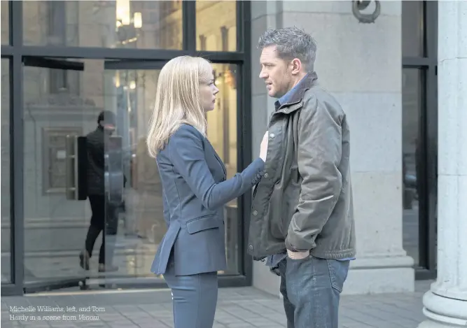  ??  ?? Michelle Williams, left, and Tom Hardy in a scene from Venom.