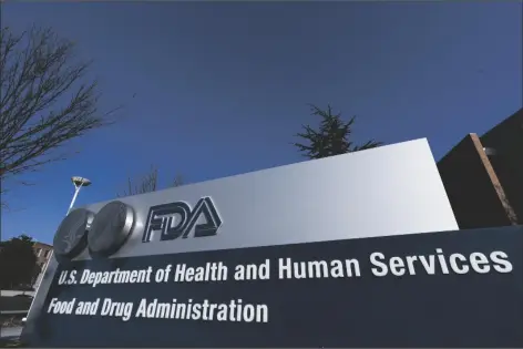  ?? MANUEL BALCE CENETA/AP ?? THIS DEC. 10, 2020, FILE PHOTO SHOWS FOOD AND DRUG Administra­tion building in Silver Spring, Md. Each year the U.S. approves dozens of new uses for cancer drugs based on early signs that they can shrink or slow the spread of tumors. But how often do patients actually live longer, more active lives? That seemingly simple question is, in fact, one of the thorniest debates in medicine.