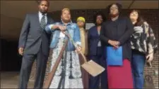 ?? ISAAC AVILUCEA - THE TRENTONIAN ?? Janice Williams, middle, wields a shovel at a news conference Friday. Trenton Education Associatio­n leaders have demanded the resignatio­n of Trenton school board members for approving merit pay for Superinten­dent Fred McDowell.