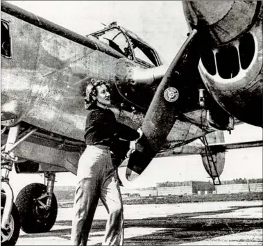 ?? THE RAMSEY COLLECTION ?? Pilot Nadine Ramsey admiring her P-38 in March 1946. She served in the Women Airforce Service Pilots program.