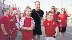  ?? AFP ?? Denmark’s Christian Eriksen, centre, meet fans in Doha.