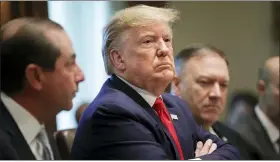  ?? PABLO MARTINEZ MONSIVAIS — THE ASSOCIATED PRESS ?? President Donald Trump, center, listening during a Cabinet meeting in the Cabinet Room of the White House, Monday in Washington. With Trump are Health and Human Services Secretary Alex Azar, left, and Secretary of State Mike Pompeo, right.