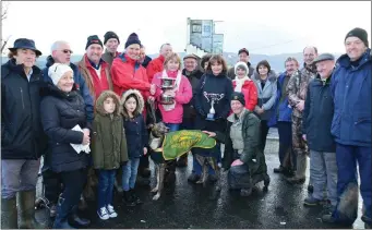  ??  ?? Kate and Ann Lynch presenting the cup to David Quirke and supporters after David’s dog, Sam John James, won the Derby Trial Stakes at Ballybegga­n coursing last week. Photos by David O’Sullivan