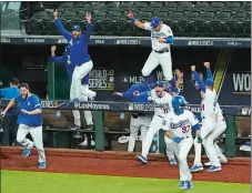  ?? TONY GUTIERREZ/ AP PHOTO ?? The Los Angeles Dodgers celebrate after defeating the Tampa Bay Rays 3-1 Tuesday in Arlington, Texas, to win the World Series in six games.