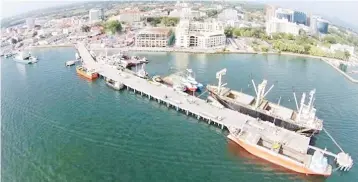  ??  ?? To ease and expedite cargo handling, the Labuan Port is also equipped with a reach stacker (a vehicle used for handling intermodal cargo containers in small terminals or medium-sized ports).