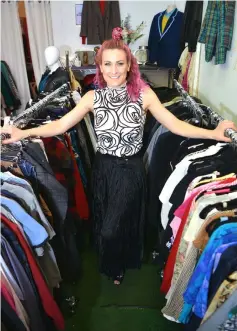  ??  ?? Sarah Freeman, founder of the Clothes Library store where customers can borrow and return good-quality secondhand clothes for a small monthly subscripti­on fee, posing at her shop in Sydney. — AFP photos