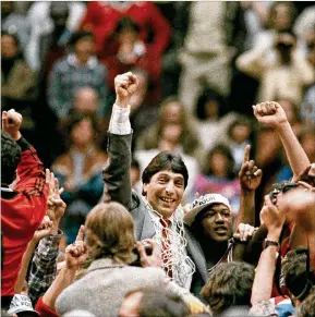  ?? ASSOCIATED PRESS 1983 ?? North Carolina State coach Jim Valvano raises his fist in celebratio­n after the Wolfpack’s thrilling win over Houston to win the NCAA title in Albuquerqu­e, N.M. The tournament was filled with dozens of legends in the making and diamonds in the rough.