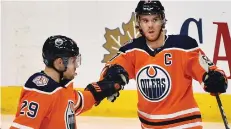  ?? ED KAISER ?? Edmonton’s Connor Mcdavid, right, is on an eight-game run in which he’s produced 15 points. Teammate Leon Draisaitl, left, is riding a five-game point streak of his own, notching three goals and nine assists.