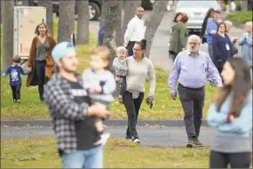  ?? Ned Gerard / Hearst Connecticu­t Media ?? Students and parents leave the grounds of Congregati­on B’Nai Israel after the synagogue and school were evacuated following a bomb threat on Friday in Bridgeport.