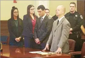  ?? CHARLIE KRAEBEL - CKRAEBEL@DIGITALFIR­STMEDIA.COM ?? Johnny Oquendo, second from right, reacts after a jury found him guilty Friday of the 2015 murder of his stepdaught­er in Troy.