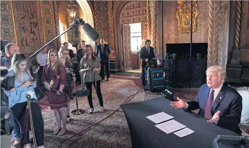  ?? AP ?? President Donald Trump speaks to reporters following his teleconfer­ence with troops from his Mar-a-Lago estate in Palm Beach on Thursday.