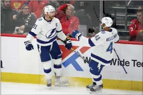  ?? NICK WASS - THE ASSOCIATED PRESS ?? Tampa Bay Lightning center Steven Stamkos (91) celebrates his winning goal with center Pierre-Edouard Bellemare (41) in overtime of an NHL hockey game against the Washington Capitals, Saturday, Oct. 16, 2021, in Washington.