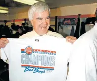  ?? MARK ELIAS/ASSOCIATED PRESS FILE PHOTO ?? Pistons general manager Jack McCloskey holds up an Eastern Conference Finals Champions T-shirt in the locker room after the Pistons beat the Chicago Bulls in 1989 in Chicago. McCloskey died Thursday at 91.