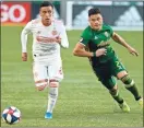  ?? Ap-sean Meagher ?? Portland Timbers’ Jorge Moreira, right, and Atlanta United’s Ezequiel Barco vie for the ball during at Providence Park in Portland, Oregon, on Sunday.