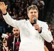  ??  ?? Mississipp­i State head football coach Mike Leach greets the crowd at Humphrey Coliseum during Saturday night’s game against Georgia. (Photo by Cody Jenkins, for Starkville Daily News)