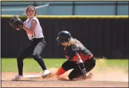  ?? NWA Democrat-Gazette/J.T. WAMPLER ?? Gravette’s Jaki Chalk gets caught at second base by Pottsville’s Abbie Cain on Monday during the 4A Tournament in Lincoln.