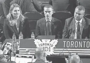  ?? GRAHAM HUGHES/ AP ?? Maple Leafs assistant general manager Hayley Wickenheis­er, left, takes part in the first round of the NHL draft on July 7.