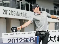  ?? CARLOS BARRIA/ REUTERS ?? Rory McIlroy tries his hand at table tennis Tuesday in Shanghai.