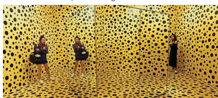  ??  ?? Visitors stand inside The Spirits Of The Pumpkins Descended Into The Heaven, a trippy installati­on by Yayoi that is a play on mirror effects and dots. Over 120 works from the veteran Japanese artist are on show at the Yayoi
Kusama: Life Is The Heart...