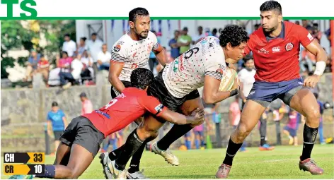  ??  ?? CH wing forward Sudarshana Muthuthant­hri attempts to barge through the CR defence - Pic by Priyantha Wickramara­chchi