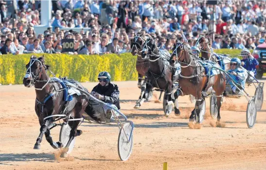  ?? Picture / Getty Images ?? Lazarus streets the field in the home straight to win the $800,000 NZ Trotting Cup at Addington yesterday.