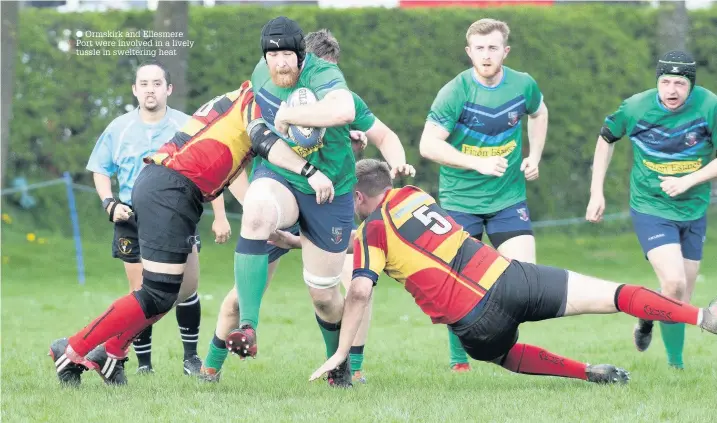  ?? Ormskirk and Ellesmere Port were involved in a lively tussle in sweltering heat ??