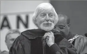  ?? STEVE MILLER/AP FILE PHOTO ?? In a May 21, 2000, file photo, Caroll Spinney, center, best known for his TV character Big Bird from “Sesame Street,” receives an honorary Doctor of Humane Letters degree from Eastern Connecticu­t State University President David G. Carter, right, during commenceme­nt in Willimanti­c. Spinney died Sunday. He was 85.