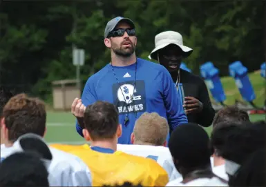  ?? / Shorter University ?? Shorter head coach Zach Morrison talks with his team during a practice session at Ben Brady Field. The Hawks will open the season Aug. 30 against Samford.