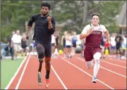  ?? NWA Democrat-Gazette/BEN GOFF • @NWABENGOFF ?? Richard Browne (left), a member of the 2012 U.S. Paralympic Team, from Jackson, Miss., runs alongside Kaiden Thrailkill of Siloam Springs on Thursday in the first heat of the 100-meter dash during the Never Say Never Foundation’s Battle of the Blades...