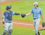  ?? Mike Carlson The Associated Press ?? Tampa Bay Rays pitcher Tyler Glasnow bumps fists Tuesday with catcher Mike Zunino.