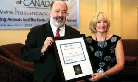  ??  ?? Michael O’Sullivan is seen here with Laureen Harper, to whom he presented the Humane Society of Canada Lifetime Achievemen­t Award in 2011. O’Sullivan was in a legal battle with Revenue Canada, which was trying to strip his charity’s tax-free status, at...