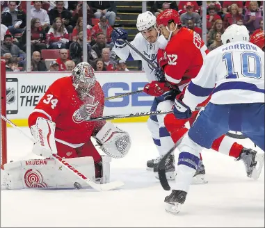  ?? — THE ASSOCIATED PRESS ?? Red Wings goalie Petr Mrazek turns aside a shot by the Lightning’s Brenden Morrow in Detroit’s 3-0 home win on Tuesday. The Red Wings lead the series 2-1.