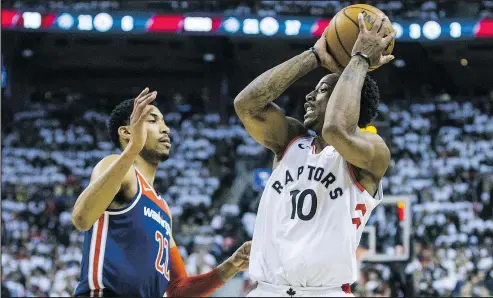  ?? ERNEST DOROSZUK/TORONTO SUN ?? The Raptors’ DeMar DeRozan looks to make a move on the Wizards’ Otto Porter during Game 1 at the ACC last night.