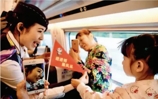  ??  ?? October 10, 2018: Railway authoritie­s launch a campaign to promote the upcoming first China Internatio­nal Import Expo on bullet trains running on the Beijing-shanghai high-speed railway, which will continue until the expo ends on November 10. VCG