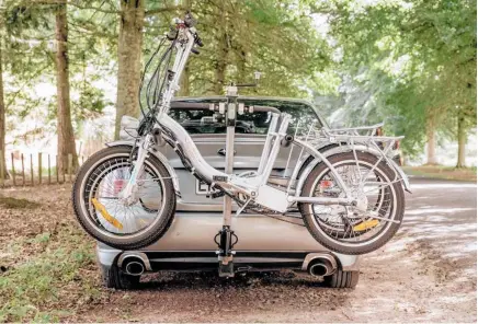  ?? ?? Don Healy’s easy-to-handle, relatively lightweigh­t bike rack makes winding the bikes on and off the vehicle a breeze.