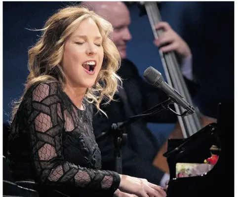  ?? BRUCE EDWARDS/EDMONTON JOURNAL ?? Diana Krall performs with bass player Dennis Crouch behind her at Edmonton’s Jubilee Auditorium on Monday night.