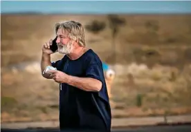  ?? ?? Alec Baldwin in the parking lot outside the Santa Fe County Sheriff's offices after being questioned about the shooting. Photograph: Jim Weber/The New Mexican