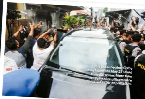  ??  ?? The chase begins: Corby leaves home (on May 27) amid a media scrum. More than 100 Bali police officers were involved in her deportatio­n.