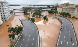  ?? Photograph: Renan Mattos/Reuters ?? Flooding in the centre of Porto Alegre, Rio Grande do Sul state after people were evacuated on 5 May.