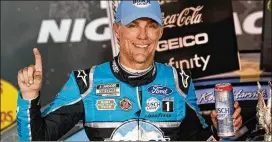  ?? STEVE HELBER / AP ?? Kevin Harvick was happy to have a crowd Saturday night. “As I was getting in the car, I was just wound up and just really, really ready to race,” he said.