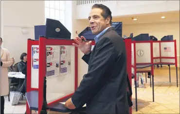  ?? ASSOCIATED PRESS FILE PHOTO ?? New York Gov. Andrew Cuomo pauses as he marks his ballot at the Presbyteri­an Church of Mount Kisco, in Mt. Kisco, N.Y.