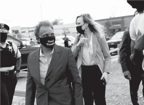  ?? JOSE M. OSORIO/CHICAGO TRIBUNE ?? Mayor Lori Lightfoot arrives Thursday in the Auburn Gresham neighborho­od to announce a new community investment initiative.