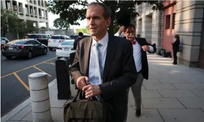  ?? September in Washington DC. Photograph: Win McNamee/Getty Images ?? Kent Walker, president of global affairs at Alphabet, trailed by Ian Madrigal dressed as ‘Monopoly Man’, departs federal court on 12