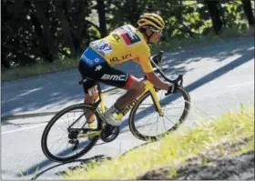  ?? PETER DEJONG — THE ASSOCIATED PRESS ?? Belgium’s Greg van Avermaet, wearing the overall leader’s yellow jersey, speeds downhill during the tenth stage of the Tour de France cycling race over 158.8kilometer­s (98.7 miles) with start in Annecy and finish in Le Grand-Bornand, France, Tuesday.