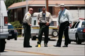  ?? GARY CORONADO/LOS ANGELES TIMES ?? The scene where a teenager was fatally shot by Los Angeles County Sheriff’s deputies in the early morning in Palmdale on Thursday. The victim, Armando Garcia, 17, was killed as he tried to stop an aggressive dog from attacking the officers.