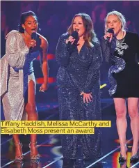  ??  ?? Tiffany Haddish, Melissa McCarthy and Elisabeth Moss present an award.