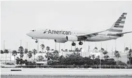  ?? WILFREDO LEE/AP ?? American Airlines said 23,500 employees have accepted buyouts, retired early or taken long-term leaves of absence, but that was not enough to avoid involuntar­y cuts.