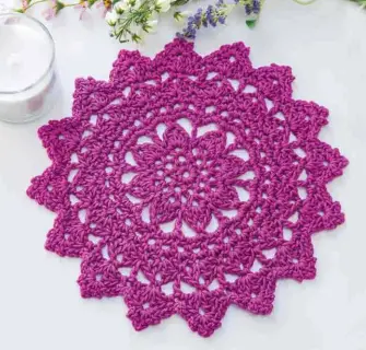  ??  ?? Add a pop of color to a dreary day! Using just 1 skein of DK-weight cotton yarn, you can crochet a new accent for your table in under 2 hours.